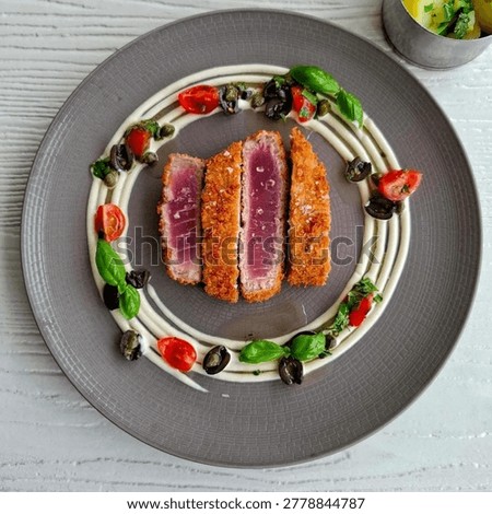 This image features a luxury fine dining presentation of fried tuna steak (Tuna Katsu) with a perfect sear