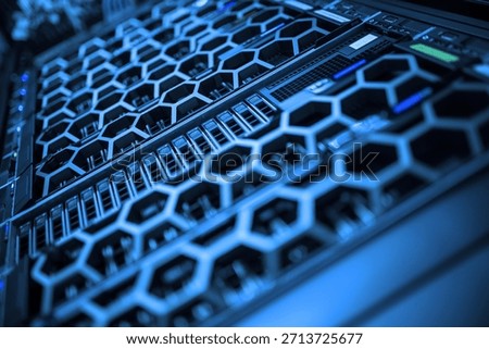 This image features a modern server array with a unique hexagonal design. The blue lighting accentuates the intricate components, highlighting the technology's sophistication.