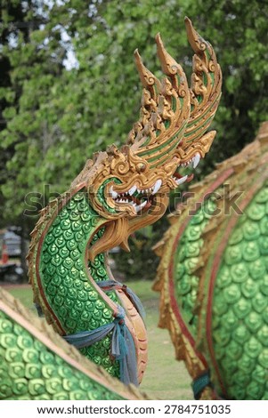 This image features a Naga known in Thai as Phaya Nak, a mythical semi divine serpent that serves as a vital symbol in Thai Buddhist and Hindu traditions.