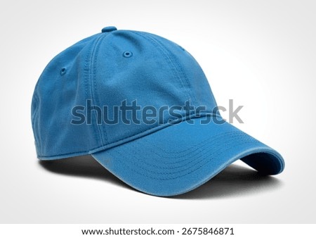 This image features a plain blue baseball cap, presented from a side angle against a clean white background. The cap has a slightly worn appearance and a curved brim.