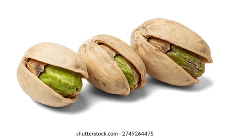 This image features a pleasing arrangement of three shelled pistachios on a pristine white background. Each nut reveals its vibrant green kernel, offering a close-up view of its texture and appealing shape. The composition is clean and modern, perfect for use in food marketing, health and wellness content, or culinary websites.