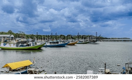 Similar – Image, Stock Photo Yellow fishing boat moored in ocean turquoise water