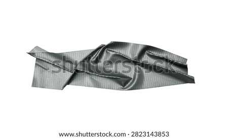 This image features a segment of grey duct tape captured in a curved form against a clean white background. The detailed texture of the woven fabric and the pronounced creases across its surface are clearly visible, emphasizing the material's flexibility and robustness. The isolation of the tape makes it a focal point, suitable for applications that require a visual representation of repair, construction, or industrial materials. The studio lighting highlights the subtle sheen and depth of the tape's texture, offering a clear and detailed perspective.