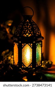 This image features a stunning lantern with colorful glass panels, beautifully lit in a dark setting. The lantern's intricate metal design and glowing light create a warm and cozy ambiance, perfect for relaxation and tranquility. The image exudes elegance and sophistication, showcasing traditional craftsmanship and artistry.