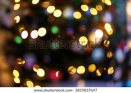 This image features a vibrant abstract bokeh background with colorful outoffocus lights