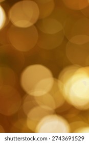 This image features a warm, festive bokeh effect with soft, glowing golden circles that evoke a joyful holiday atmosphere perfect for celebrations and seasonal decor.