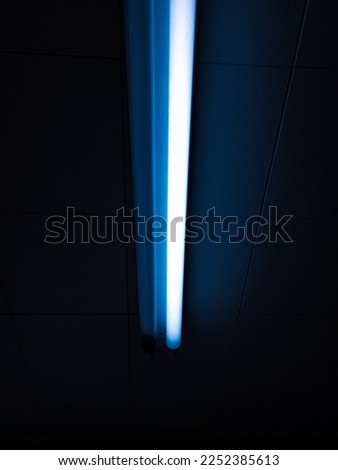 This is a image of a florescent light bulb. This photo has selective focus. 