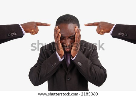 This is an image of a man feeling guilty, with two fingers pointing at him. He is at the centre of blame.