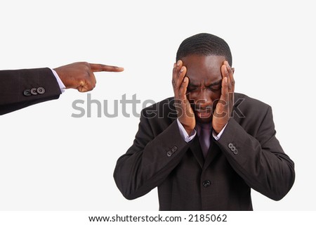 This is an image of a man feeling guilty, with a finger pointing at him.