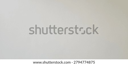 This is image of off-white surface that could be a decorative material such as laminate or coated metal. It is or soft matte. Suitable for adding text or a background. Empty wall
