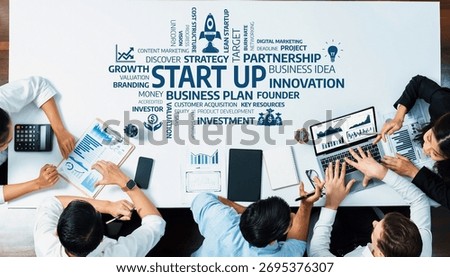 This image portrays a dynamic modern workspace where diverse professionals collaborate on strategic planning and business growth, capturing the essence of innovation and entrepreneurship. Amity