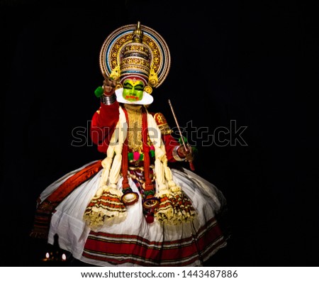 This image is the posture and facial expression of famous indian classical dance kathakali. which is performed at south indian state of kerala.