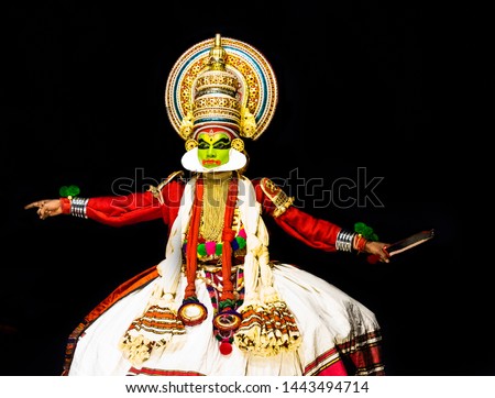 This image is the posture and facial expression of famous indian classical dance kathakali. which is performed at south indian state of kerala.