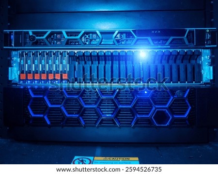This image showcases advanced data center equipment featuring a blue light and a honeycomb design, symbolizing modern technology and innovation in digital storage.