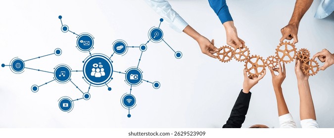This image showcases a collaborative environment where diverse hands work together with gears, symbolizing connectivity in digital media and teamwork dynamics. Amity