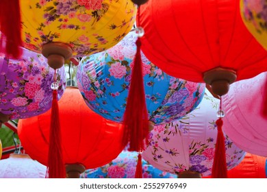 This image showcases colorful lanterns featuring rich patterns and intricate designs. The diverse colors and floral motifs create a lively atmosphere.

 - Powered by Shutterstock