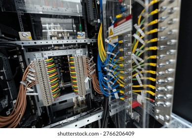 This image showcases the complex wiring within a server rack, highlighting various cables and connectors that ensure effective data management and communication.