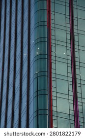 This image showcases the dynamic and modern skyline of Ho Chi Minh City, where sleek glass skyscrapers rise majestically against a backdrop of a clear blue sky. The towering buildings, with their reflective facades and contemporary designs, embody the rapid urban growth and architectural innovation that define this vibrant Vietnamese metropolis. The clean lines and impressive heights of the structures highlight the city's commitment to modernity and progress. The image captures the essence of Ho Chi Minh City's evolving cityscape, where cutting-edge architecture meets the bustling energy of urban life, creating a visually stunning representation of development and ambition in Southeast Asia.