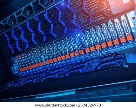 This image showcases a high-tech server rack filled with advanced storage devices and features glowing blue LED lights, highlighting modern IT infrastructure and connectivity.