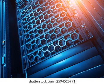 This image showcases a modern data center rack filled with advanced server components, featuring intricate designs and ambient lighting, symbolizing technology and innovation.