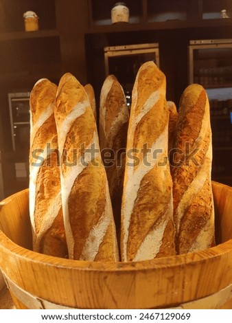 Similar – Image, Stock Photo a wooden basket filled to the brim with strawberries stands on straw