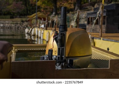 This image shows a close up view of a boat's motor.
