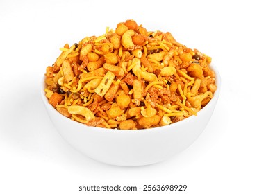 This image shows a close-up of a white bowl containing a mix of crunchy, fried snacks in shades of yellow and orange. The assortment includes different shapes, indicating a variety of textures and fla - Powered by Shutterstock