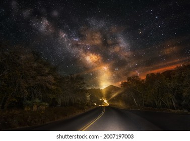 This Image Shows An Epic Night Time Milky Way Sky Over A Remote, Secluded Road.