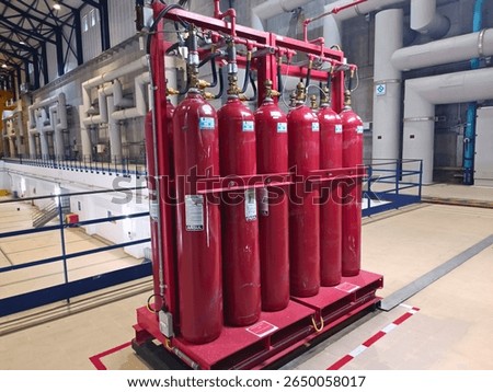 This image shows a CO₂ fire suppression system installed in an industrial facility.