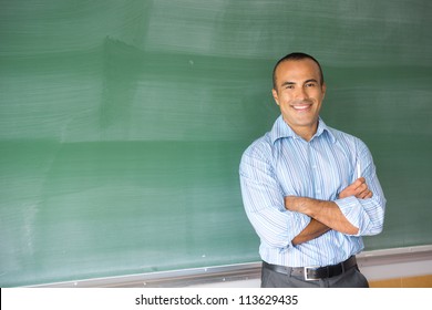 This image shows a Hispanic Male Teacher in his classroom