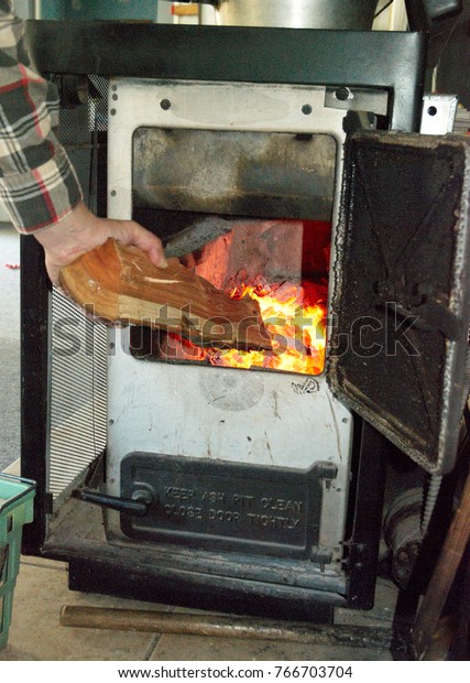 This Image Shows Man Putting Wood Stock Photo Edit Now 766703704