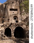 This image shows rock-carved structures located in the Güzelyurt Monastery Valley.