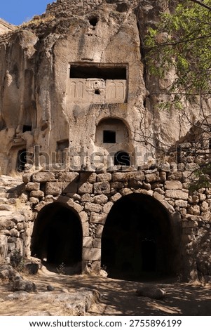 This image shows rock-carved structures located in the Güzelyurt Monastery Valley.