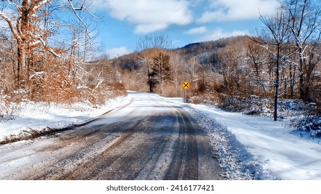 This an image of a snow covered country road in the mountains of Virginia. - Powered by Shutterstock