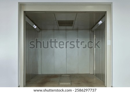 This industrial elevator interior is designed for efficient transport of goods and materials