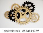 This industrial gear wall clock combines black and wooden cogs to create a striking steampunk-inspired piece.