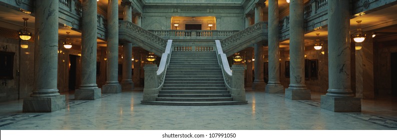 This Is The Interior Of The State Capitol Of Utah. Marble Columns Are At The Sides Of A Very Wide, Grand Staircase Leading To The Second Floor.