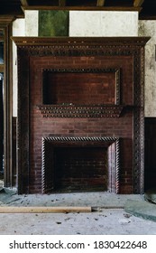 This is an interior view of an ornate brick fireplace at the long-abandoned and historic Dunnington Mansion in Farmville, Virginia.