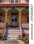 This inviting and cheerful porch is an example of the kind of colorful Queen Anne Victorian architecture typical of Cape May. 
