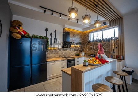 This inviting kitchen features a stylish design with a touch of holiday cheer, perfect for cooking and entertaining