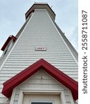 This lighthouse, built in 1867, stands tall with its distinctive red and white design, guiding sailors safely along the coast through the years.