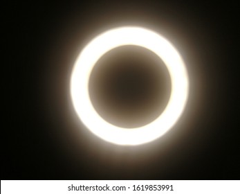 This is like the shadow of a round light cirlcle in the dark as street light reflection