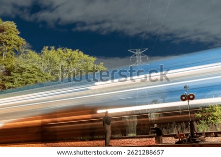 This is a long exposure shot taken as a diesel engine passed in front of the camera. This created a nice light effect making a nice photo. 