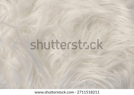 This luxurious fur texture in a cloud dancer hue creates a sense of warmth and comfort