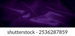 This luxurious purple satin fabric image captures the beauty of smooth folds and a rich, royal color palette The soft sheen adds a layer of elegance making it ideal for creative and decorative project