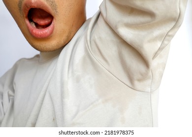 This Man's Clothes Are Soaked By Underarm Sweat.