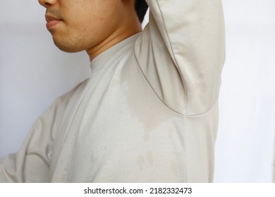 This Man's Clothes Are Soaked By Underarm Sweat.