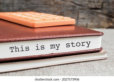 THIS IS MY STORY phrase written on notebook