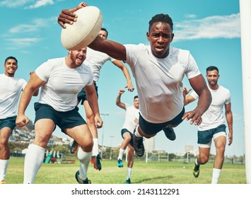 This Is For My Team. Shot Of A Rugby Player Scoring A Try While Playing On A Field.