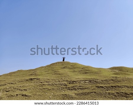 Similar – Image, Stock Photo Four people standing in a row on a ridge (2/2)